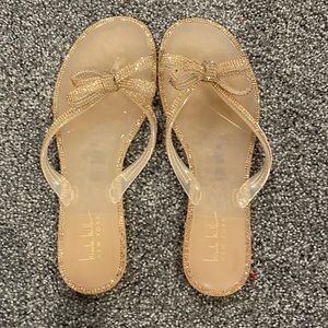 Coral pink bedazzled flip flops